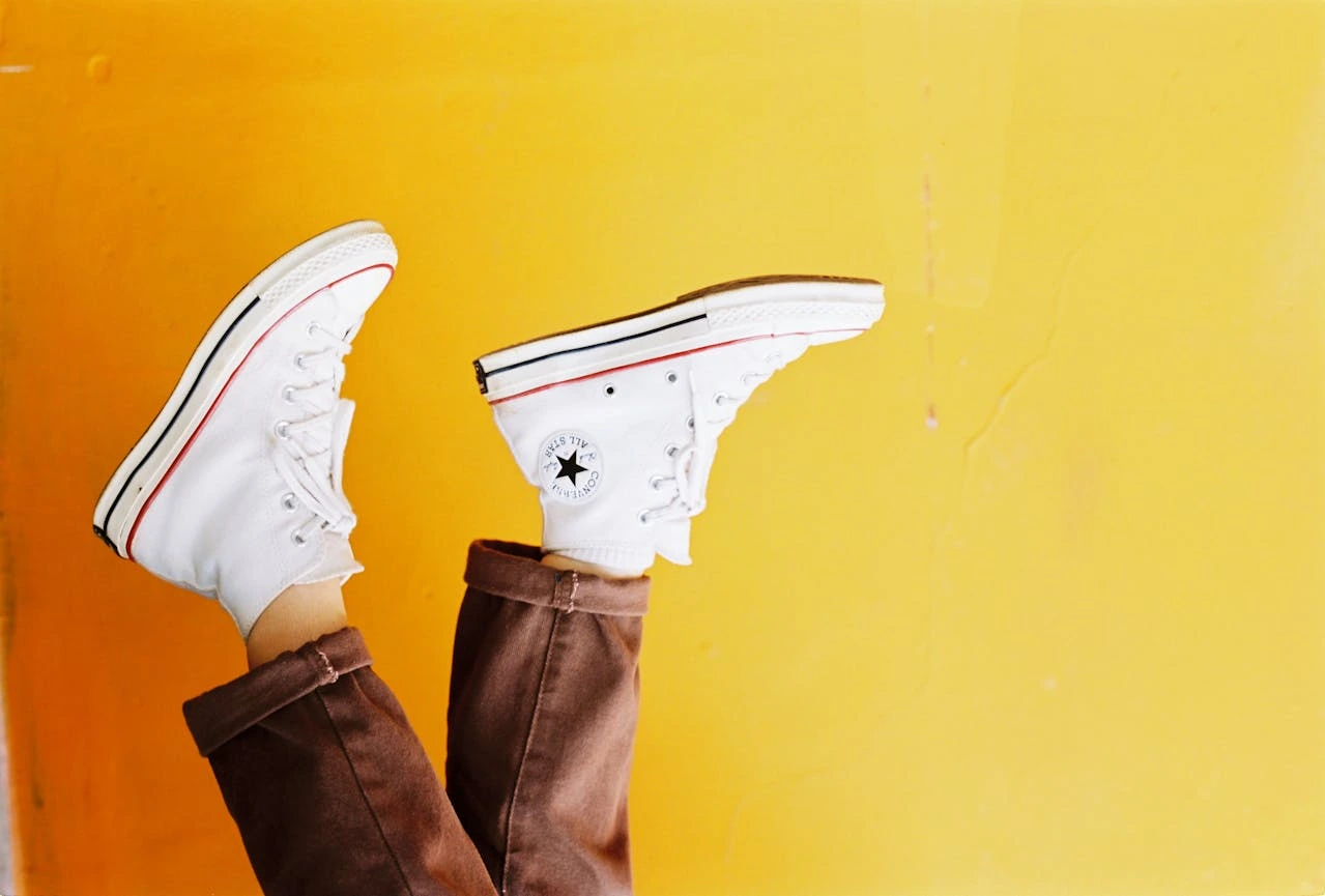 converse sneakers on a yellow background